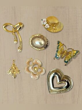 Vintage Gold-Tone Brooch Set with Cream and Blue Accents (Set of 7)
